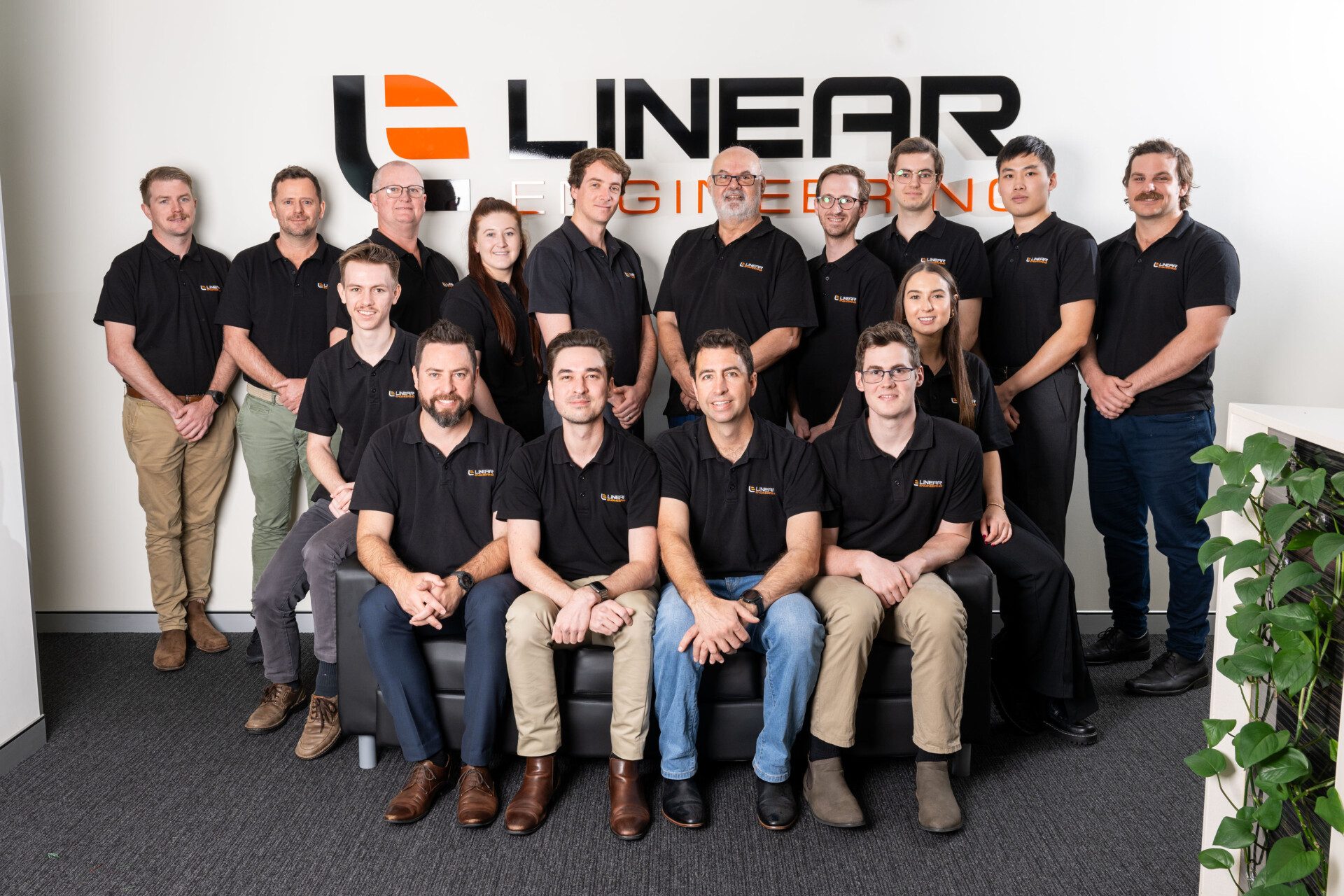 a group of people posing for a photo at Linear Brisbane office